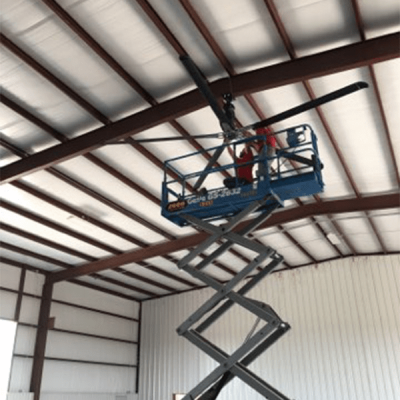 white building with brown iron structure